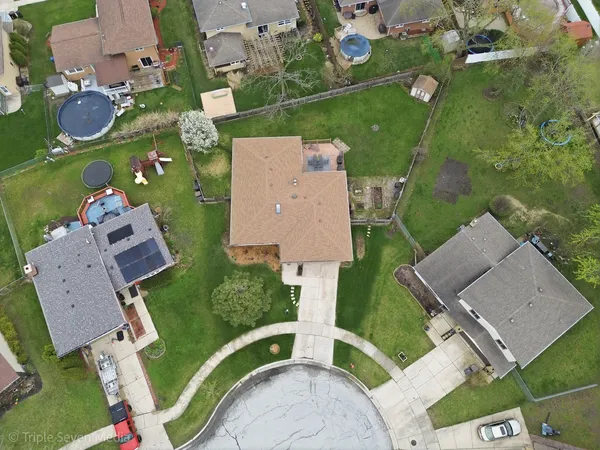 an aerial view of residential houses with outdoor space