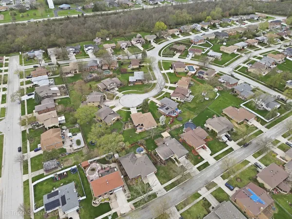 an aerial view of residential houses with outdoor space