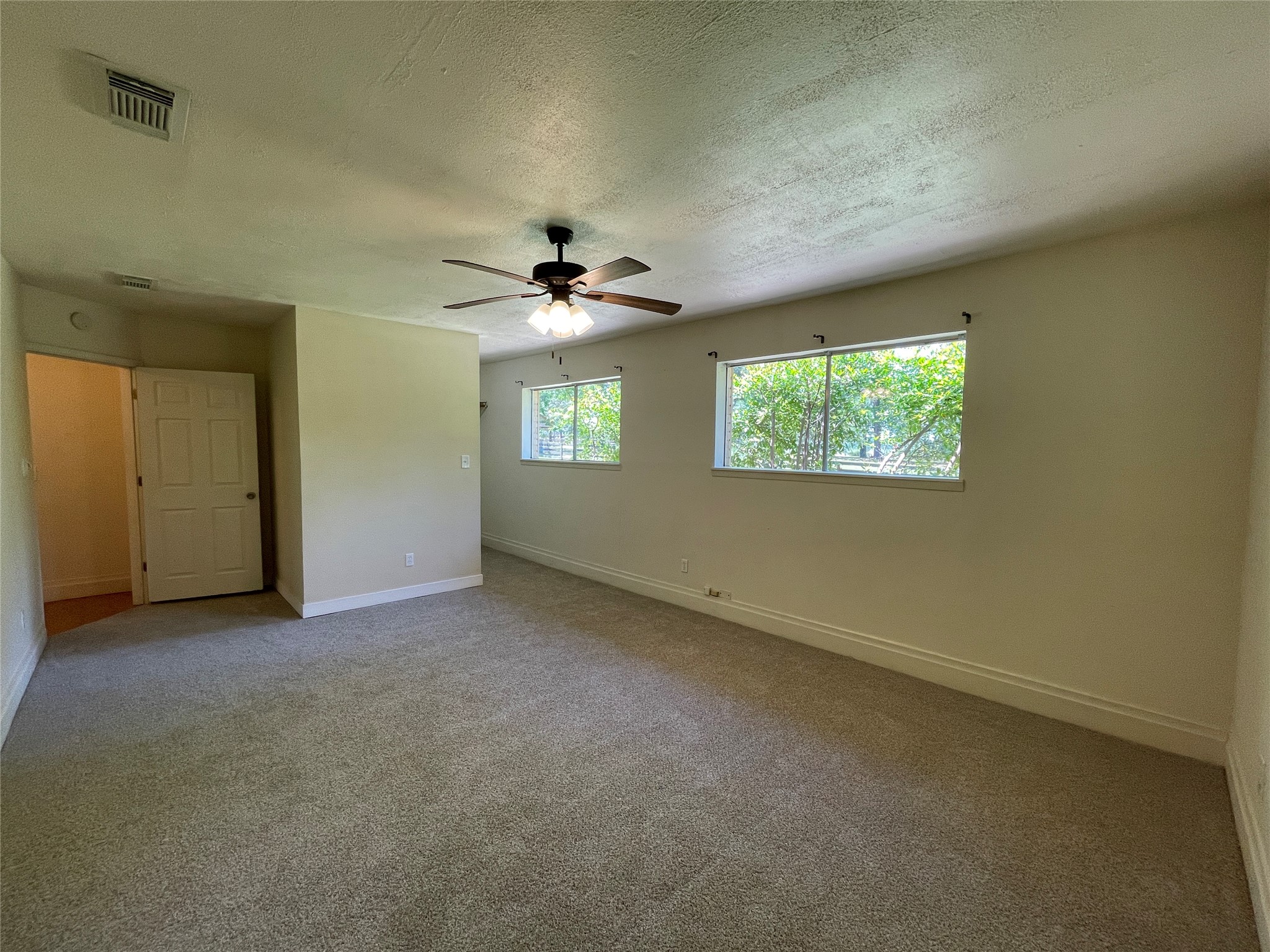 19439 Keenan Cut Off Road Montgomery, TX 77316 - Photo 20 of 39 Freshly carpeted primary bedroom