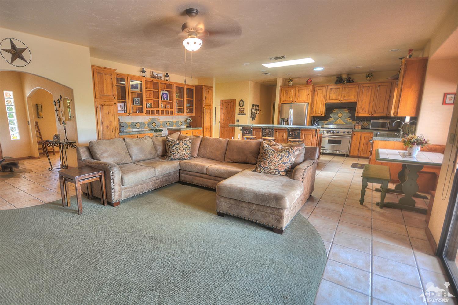 39825 Berenda Road Temecula, CA 92591 - Photo 17 of 54 a living room with furniture and kitchen view