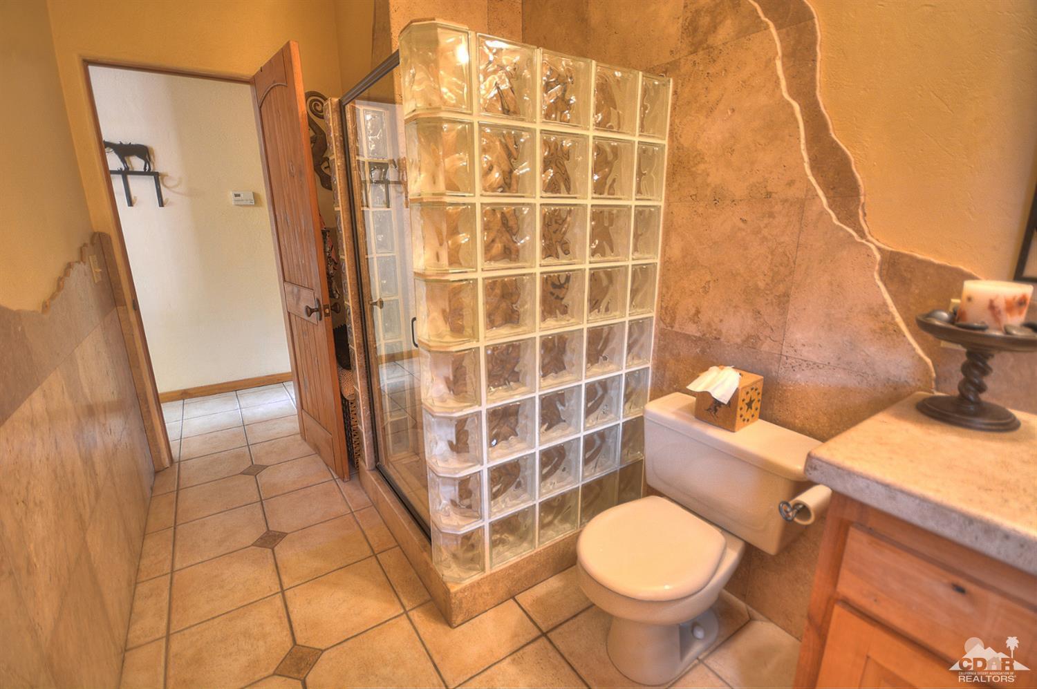 39825 Berenda Road Temecula, CA 92591 - Photo 21 of 54 a bathroom with a toilet and a shower
