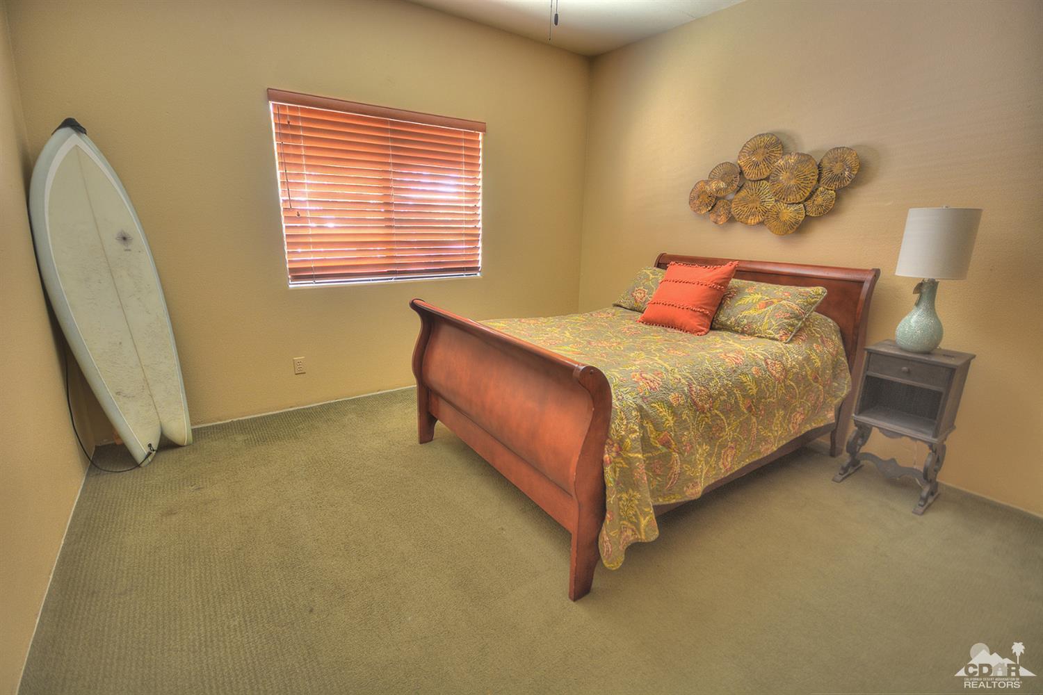 39825 Berenda Road Temecula, CA 92591 - Photo 22 of 54 a bed sitting in a room next to a window