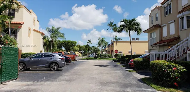 a view of a cars parked in front of a building