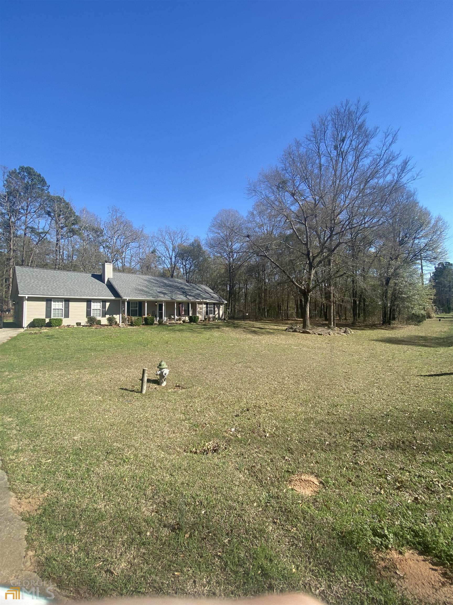 437 Barnetts Bridge Road Jackson, GA 30233 - Photo 1 of 1 a view of a field with large trees