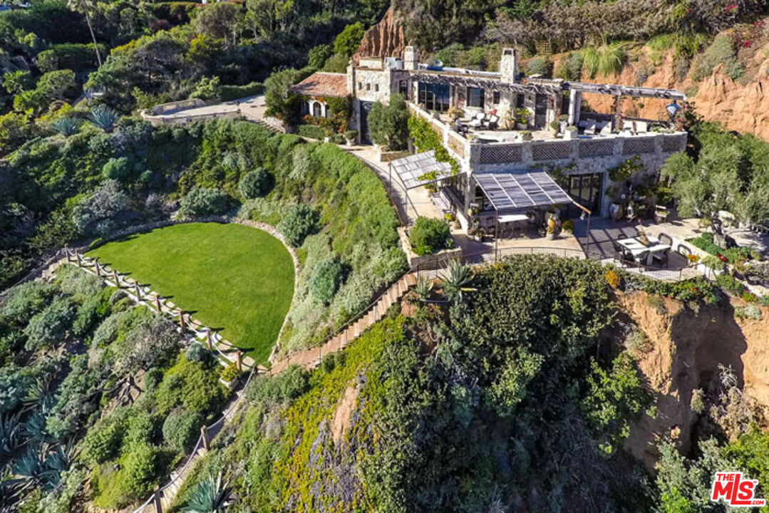 32232 Pacific Coast Highway Malibu, CA 90265 - Photo 16 of 26 an aerial view of a house with a garden and swimming pool