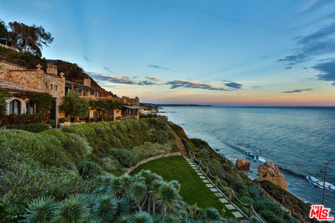 32232 Pacific Coast Highway Malibu, CA 90265 - Photo 20 of 26 a view of a lake with a yard
