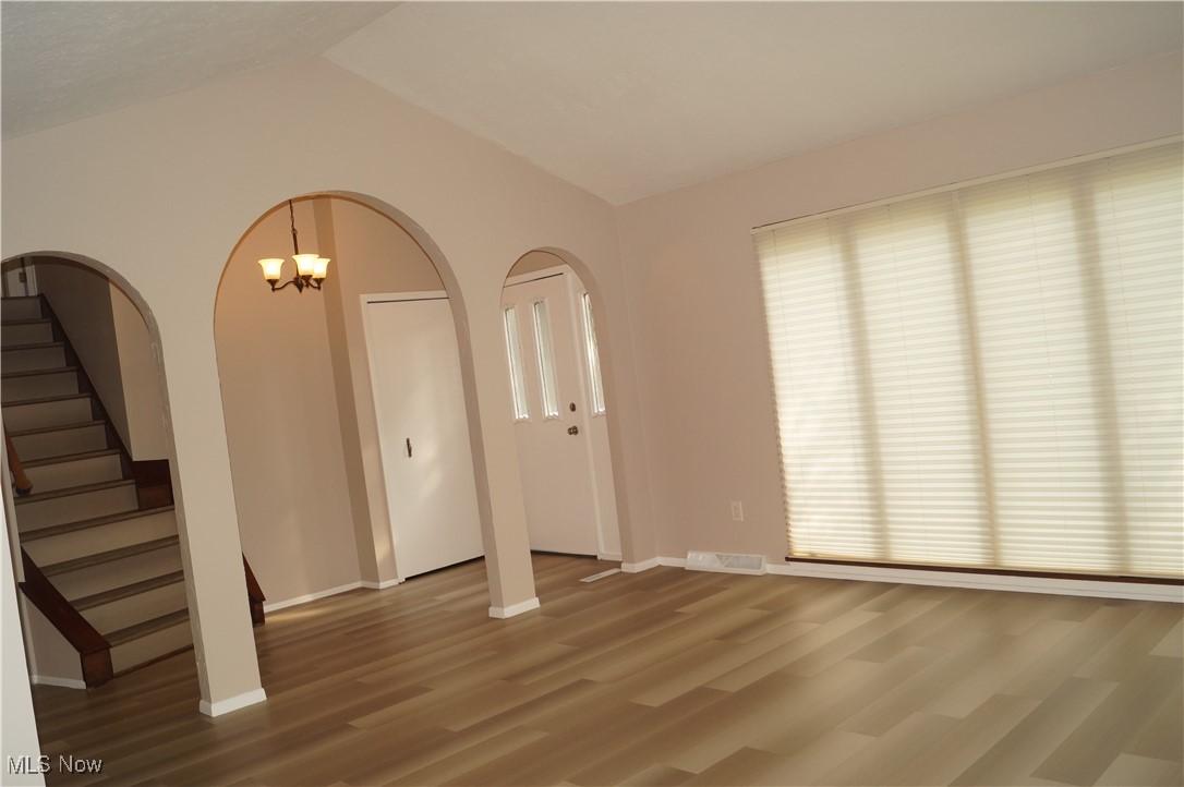 7372 Liberty Road Solon, OH 44139 - Photo 3 of 33 Living room featuring full floor to ceiling windows and blinds