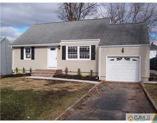 76 Middle Hill Road Colonia, NJ 07067 - Photo 2 of 12 a view of a house with a yard