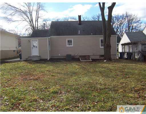 76 Middle Hill Road Colonia, NJ 07067 - Photo 11 of 12 a view of a house with a yard