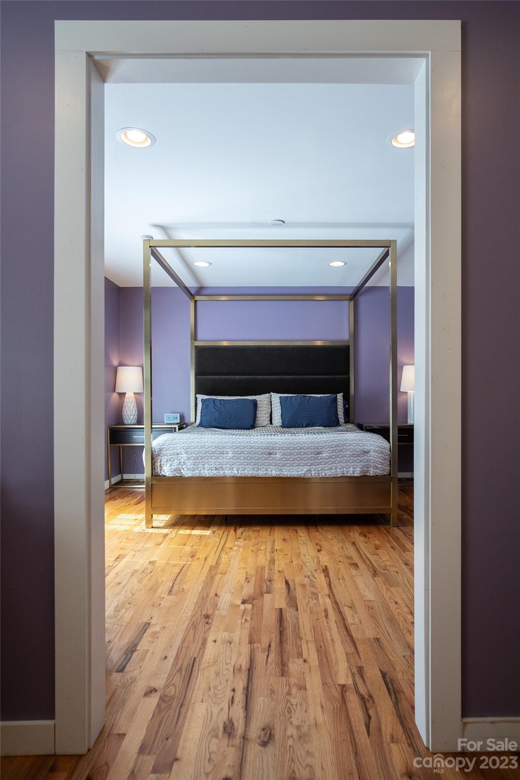 189 Mitchell Road Sylva, NC 28779 - Photo 26 of 39 a bedroom with a bed and wooden floor