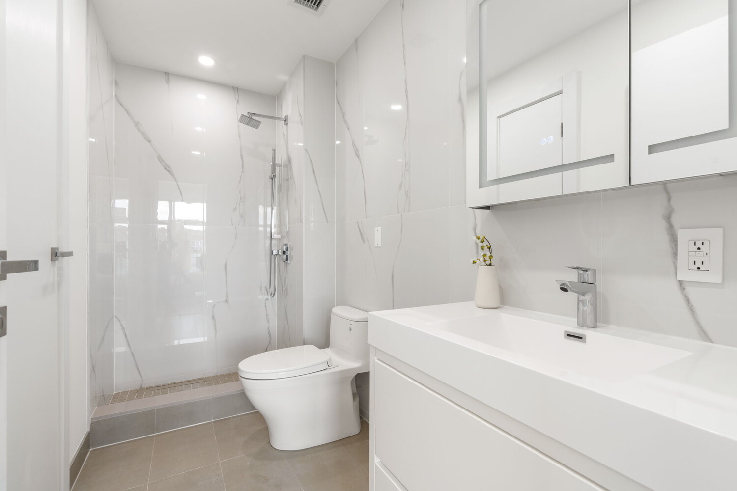 379 Ocean Parkway, Unit 2B Brooklyn, NY 11218 - Photo 10 of 24 a bathroom with a sink a toilet and shower