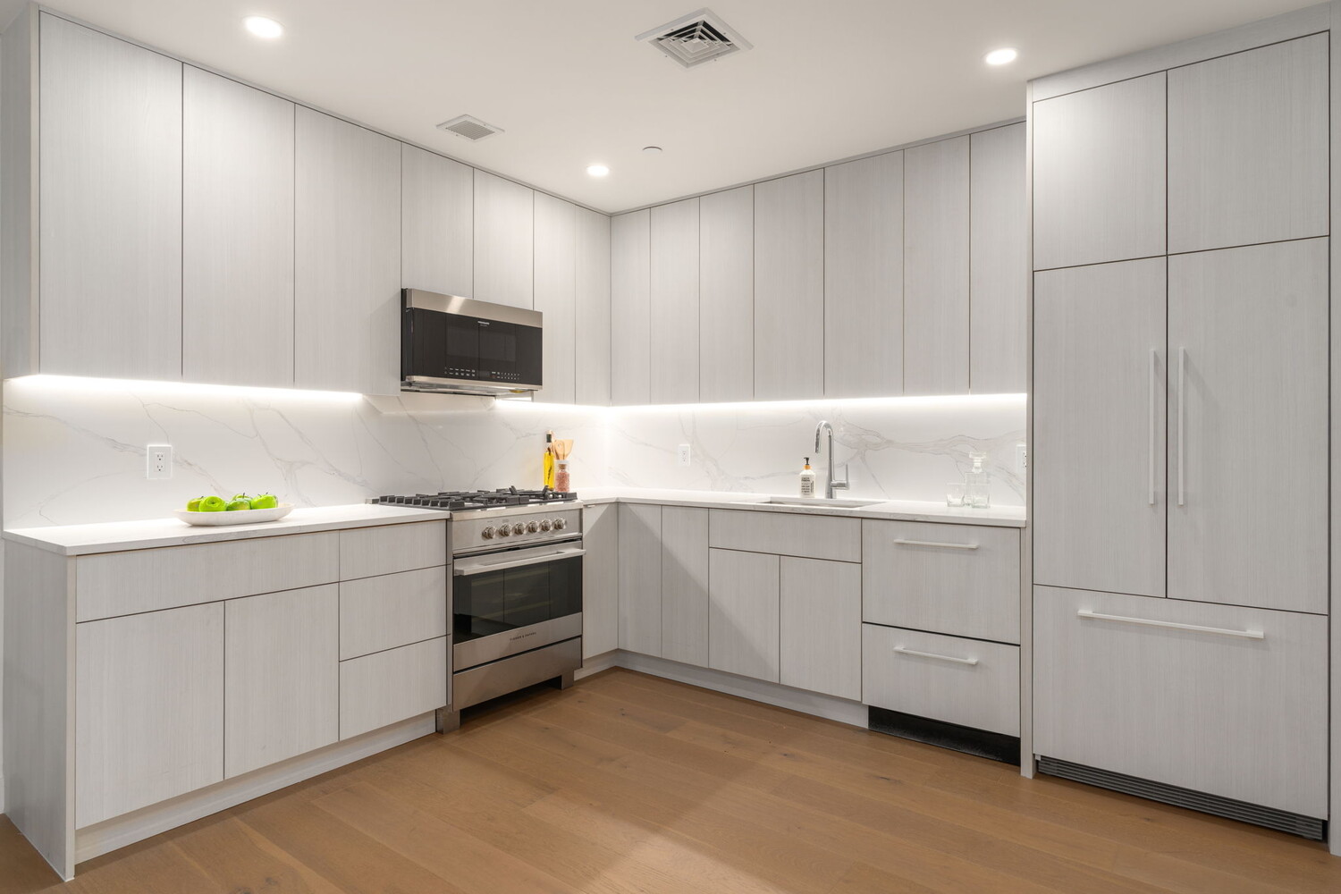 379 Ocean Parkway, Unit 2B Brooklyn, NY 11218 - Photo 4 of 24 a kitchen with a sink and white cabinets