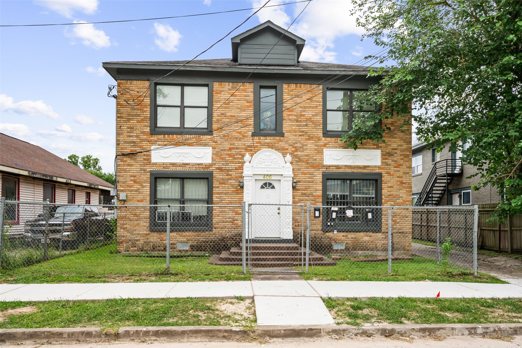 a front view of a house with a yard