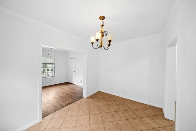 a view of livingroom with hardwood floor and kitchen view