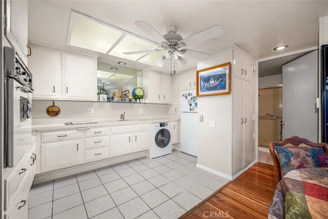 a kitchen with a cabinets and window