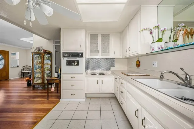 a kitchen with stainless steel appliances granite countertop a sink and cabinets