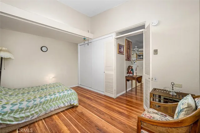 a bed room with two beds and a chair