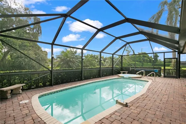 a view of a swimming pool with a patio