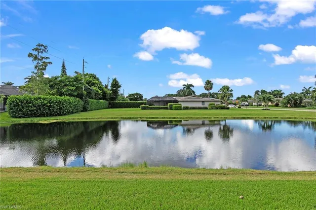 a view of a lake with a house in the background