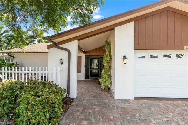 a view of a house with a small yard