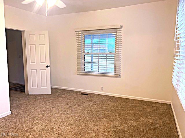 71056 Morristown Flushing Road Flushing, OH 43977 - Photo 12 of 15 Unfurnished room with carpet floors and ceiling fan