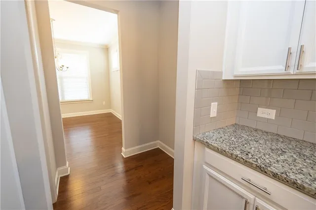 a bathroom with a granite countertop window and a sink