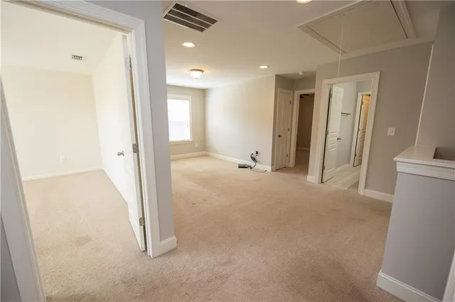 an empty room with a bathroom