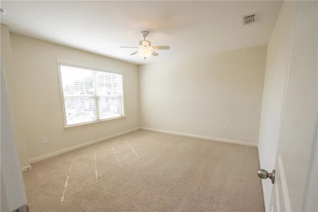 a view of a bathroom with a glass door