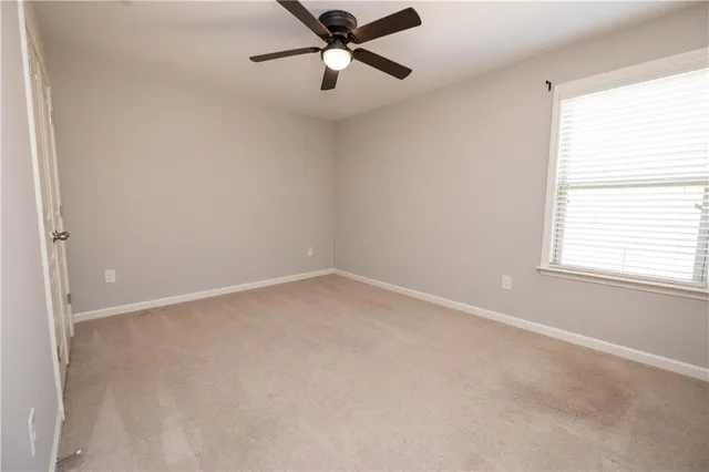 a spacious bathroom with a double vanity sink a mirror and a bathtub