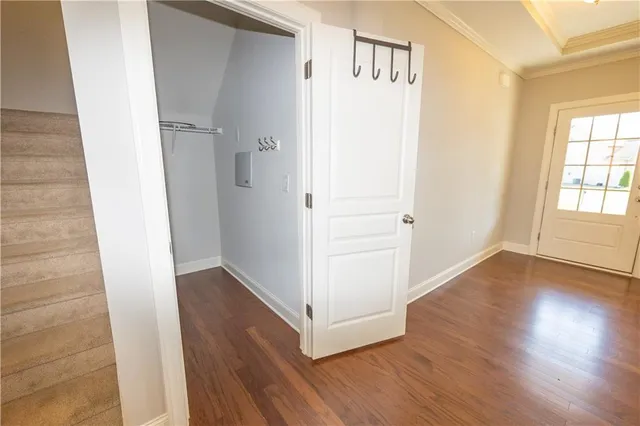 wooden floor in an empty room with a window