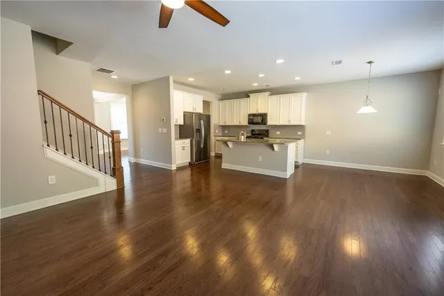 a view of a kitchen with sink and microwave