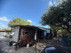 a view of a chairs and tables in patio
