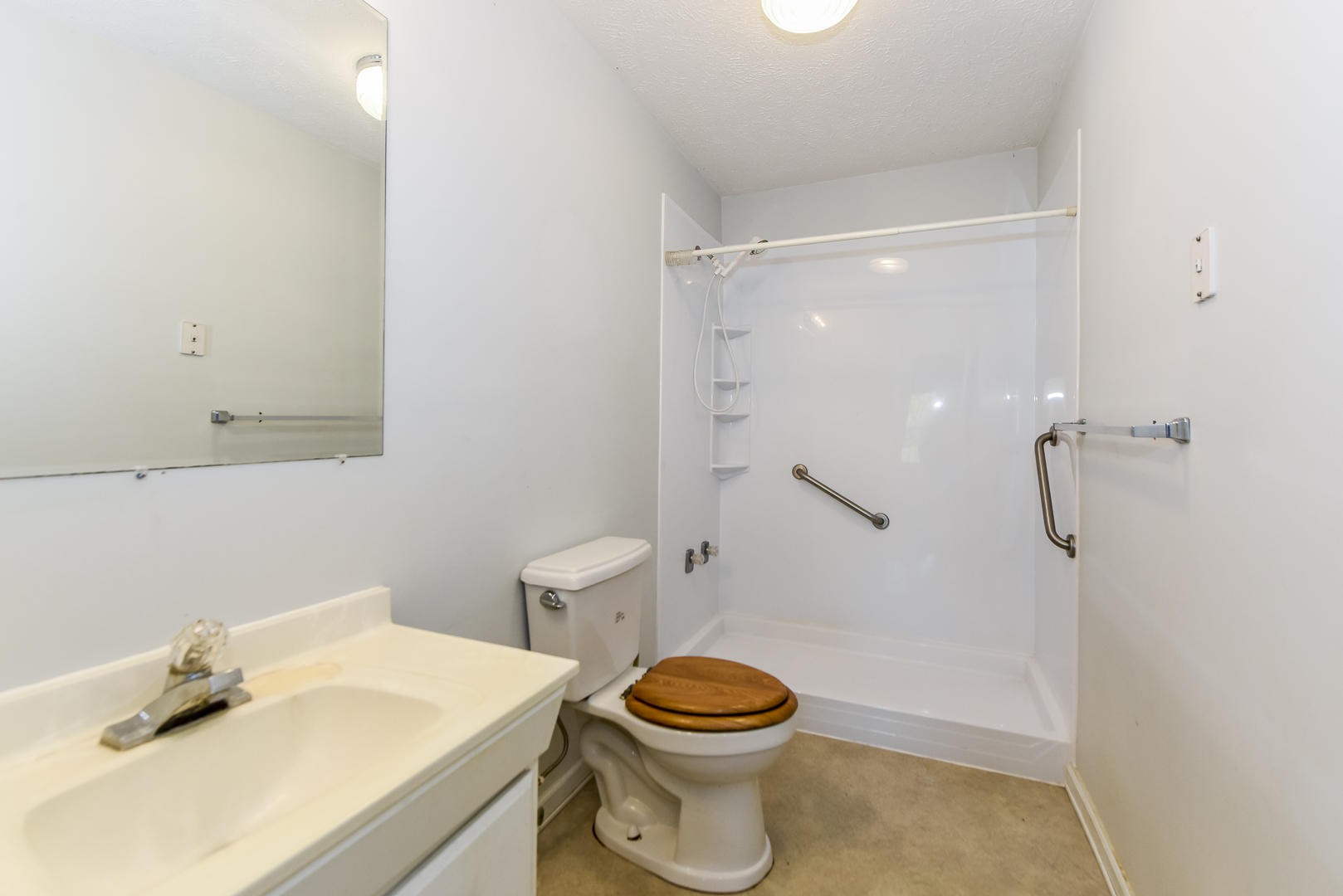 2021 Sockless Road Dandridge, TN 37725 - Photo 8 of 19 a white toilet sitting next to a bathroom sink