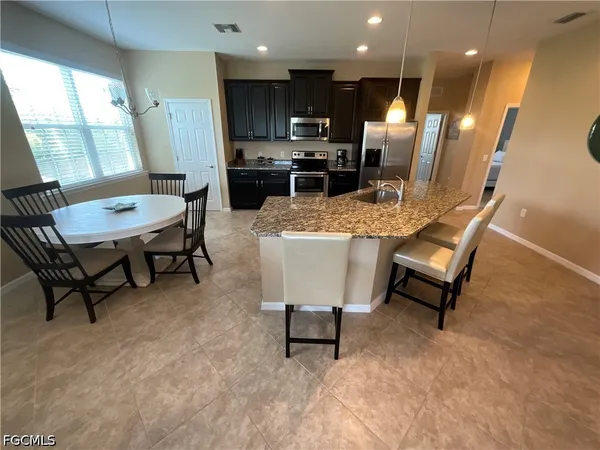 a view of a dining room with furniture