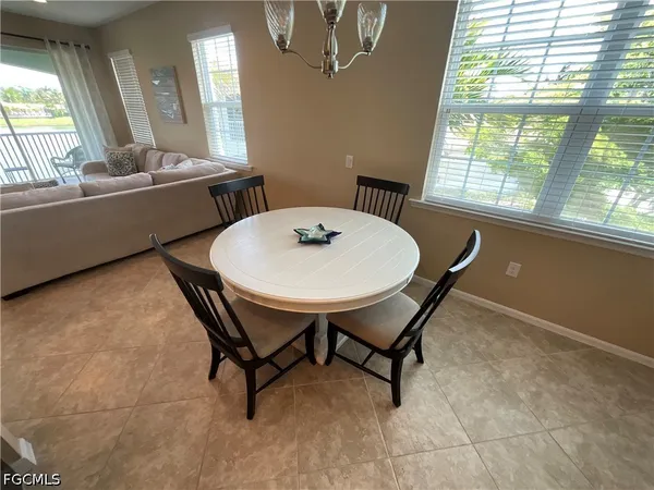 a view of a dining room with furniture and a window