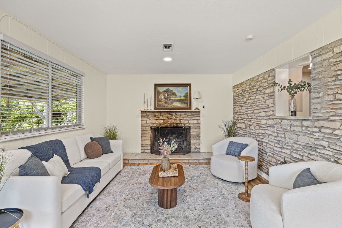 3205 Whites Drive Austin, TX 78735 - Photo 13 of 31 a living room with furniture and a fireplace