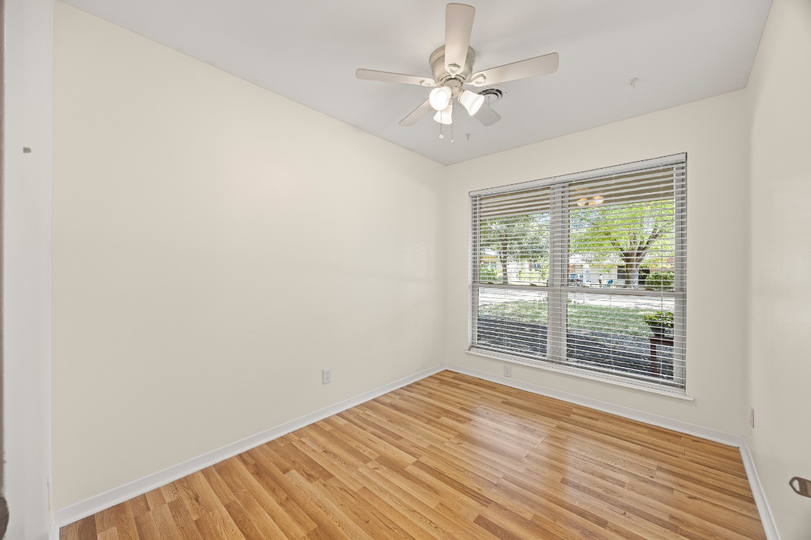 3205 Whites Drive Austin, TX 78735 - Photo 16 of 31 a view of an empty room with wooden floor and a window