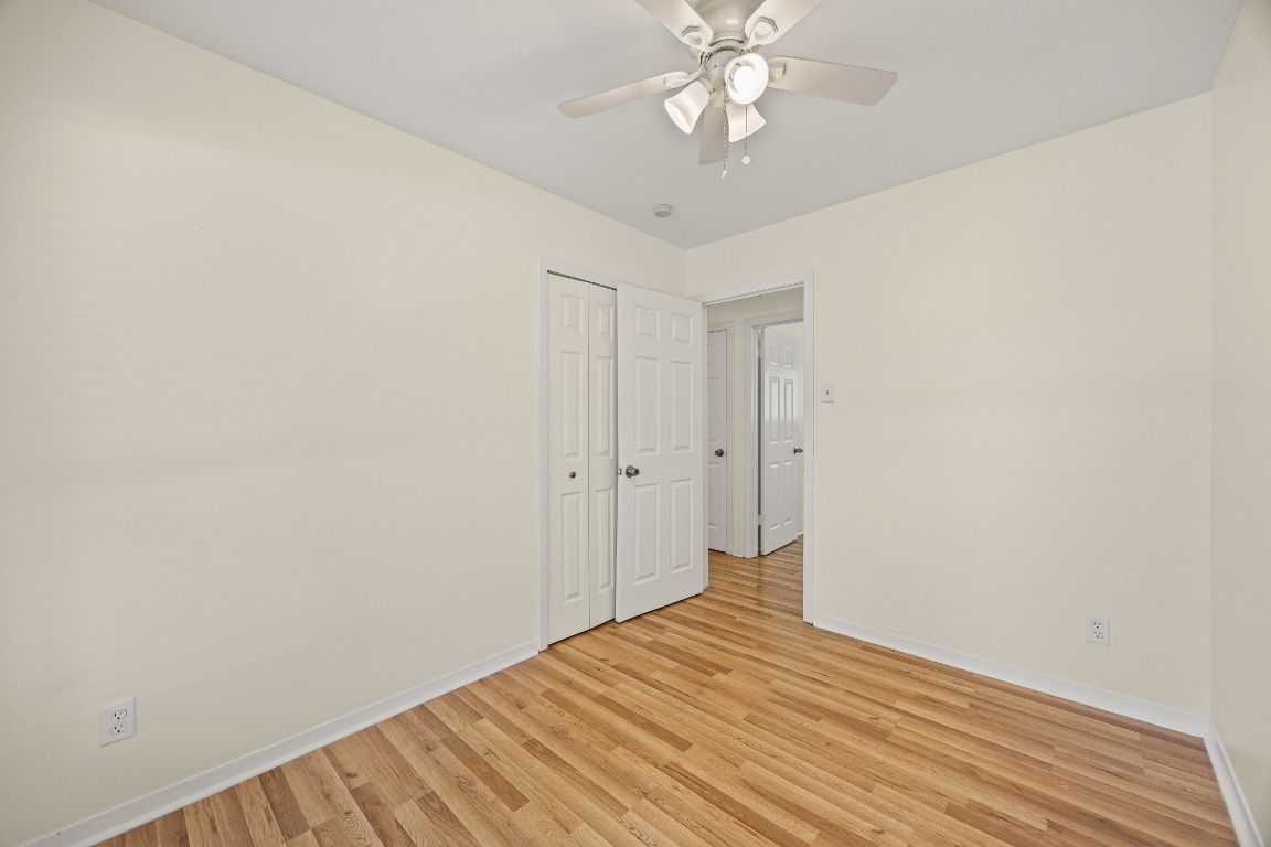 3205 Whites Drive Austin, TX 78735 - Photo 17 of 31 a view of a big room with wooden floor and closet area