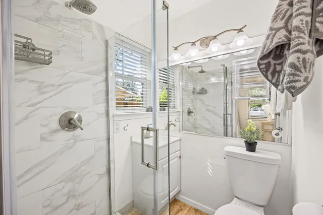 a bathroom with a bathtub and shower