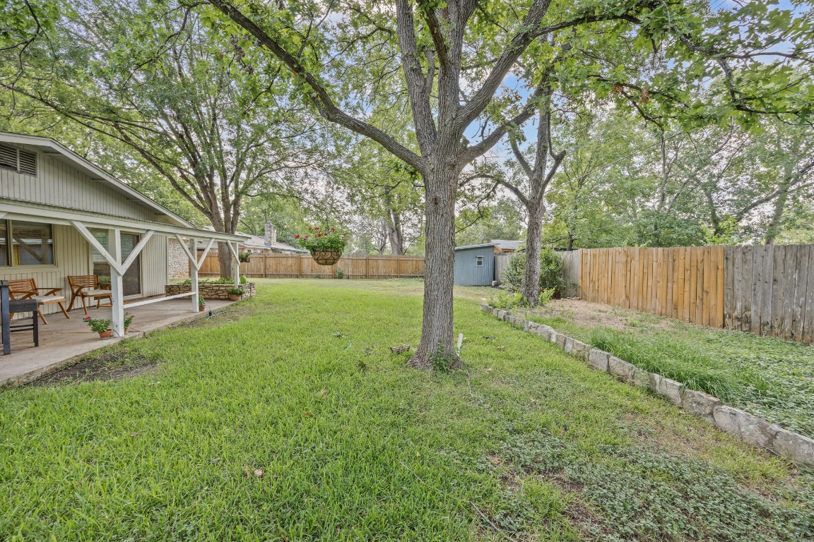 3205 Whites Drive Austin, TX 78735 - Photo 29 of 31 a view of a yard with a tree