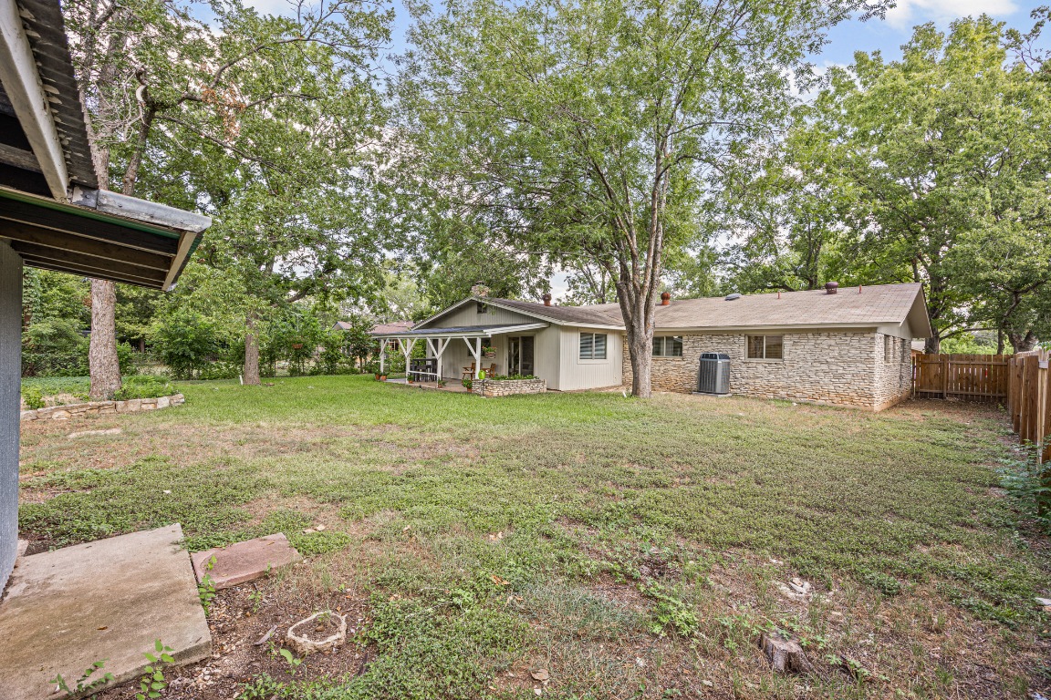 3205 Whites Drive Austin, TX 78735 - Photo 30 of 31 a front view of a house with a garden and trees