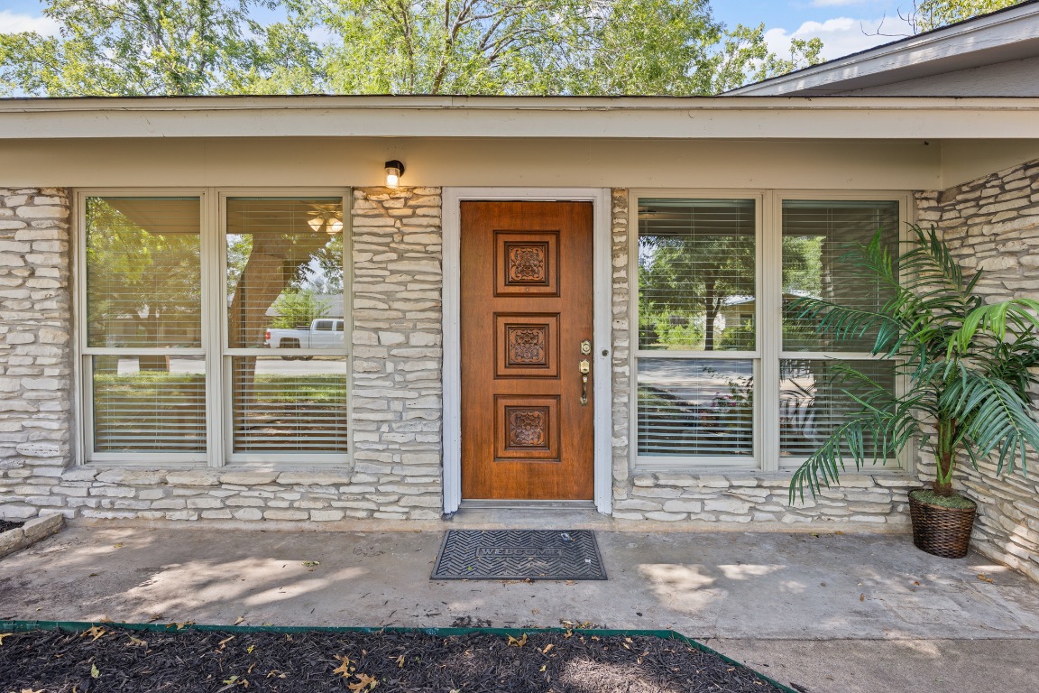3205 Whites Drive Austin, TX 78735 - Photo 4 of 31 a front view of a house with large windows