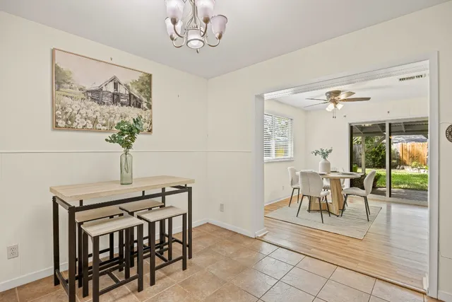 a view of a dining room with furniture window and outside view