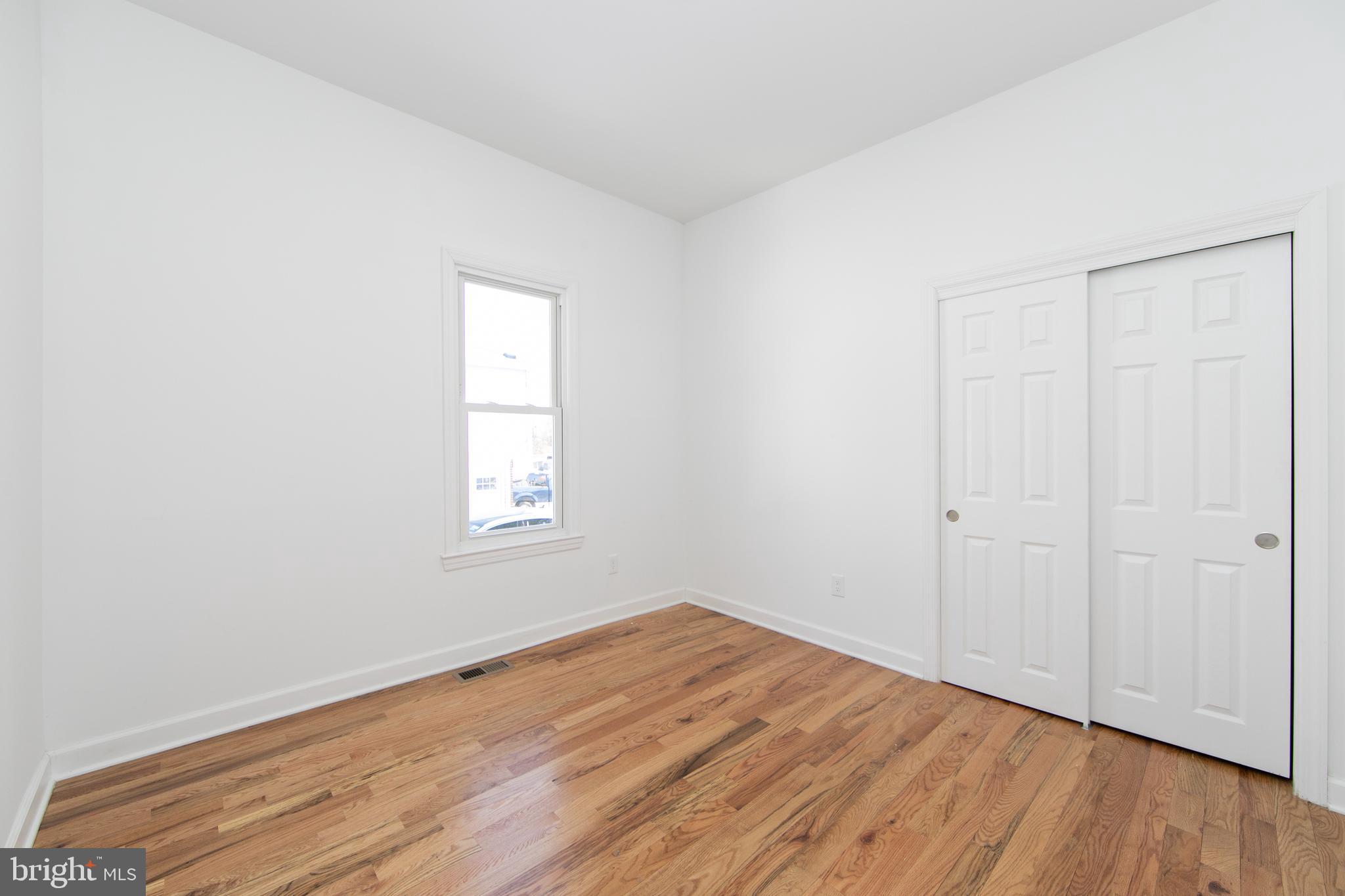 117 West Nicholson Road Audubon, NJ 08106 - Photo 23 of 32 an empty room with wooden floor and window