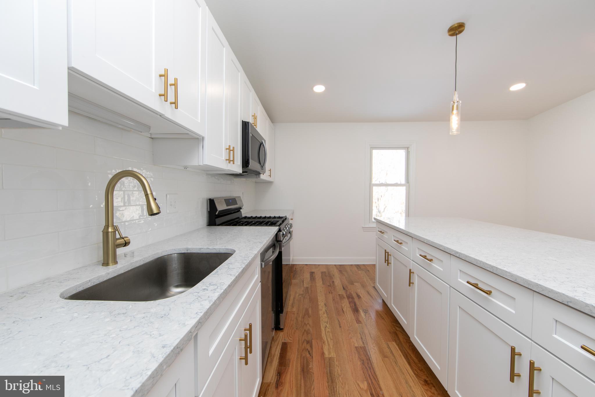 117 West Nicholson Road Audubon, NJ 08106 - Photo 8 of 32 a kitchen with cabinets a sink and appliances