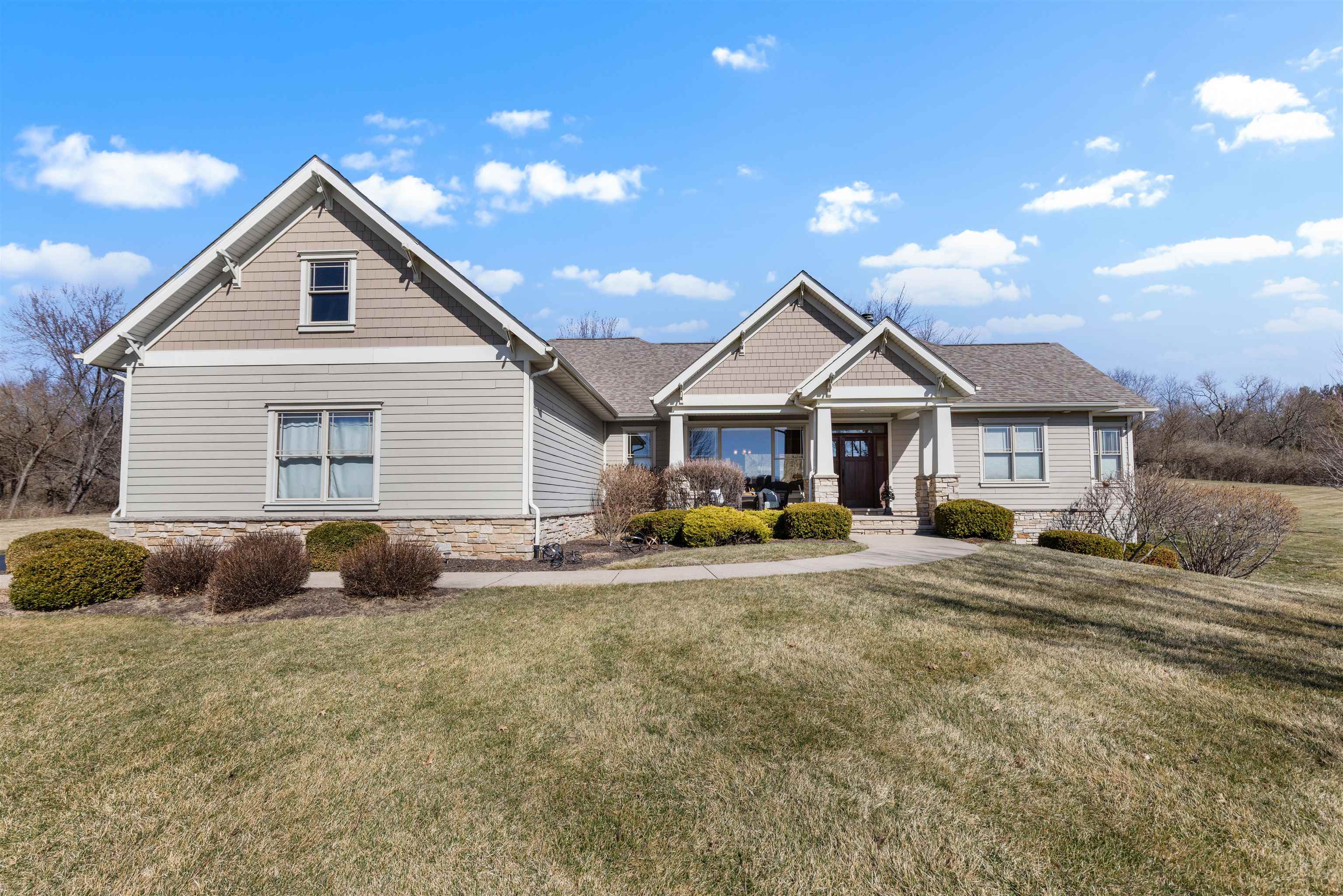 978 Weatherfield Way Belvidere, IL 61008 - Photo 2 of 41 a front view of a house with yard and porch