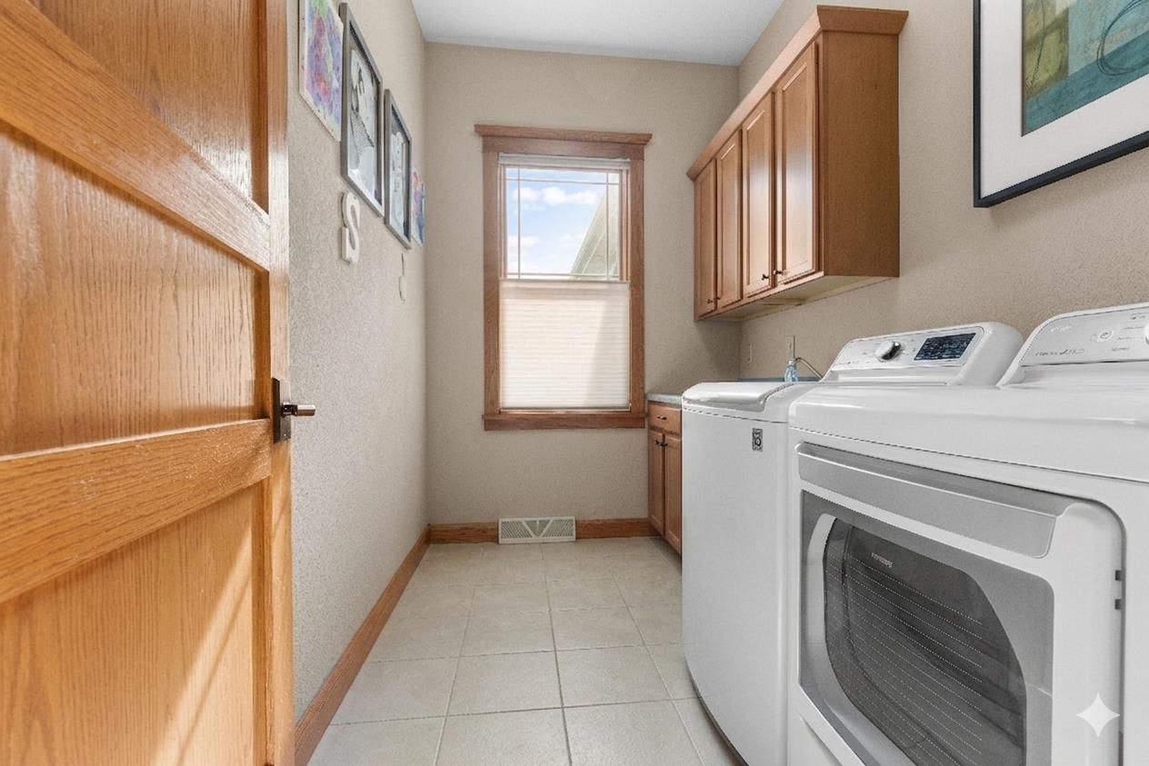 978 Weatherfield Way Belvidere, IL 61008 - Photo 21 of 41 a view of a storage & utility room with dryer and washer