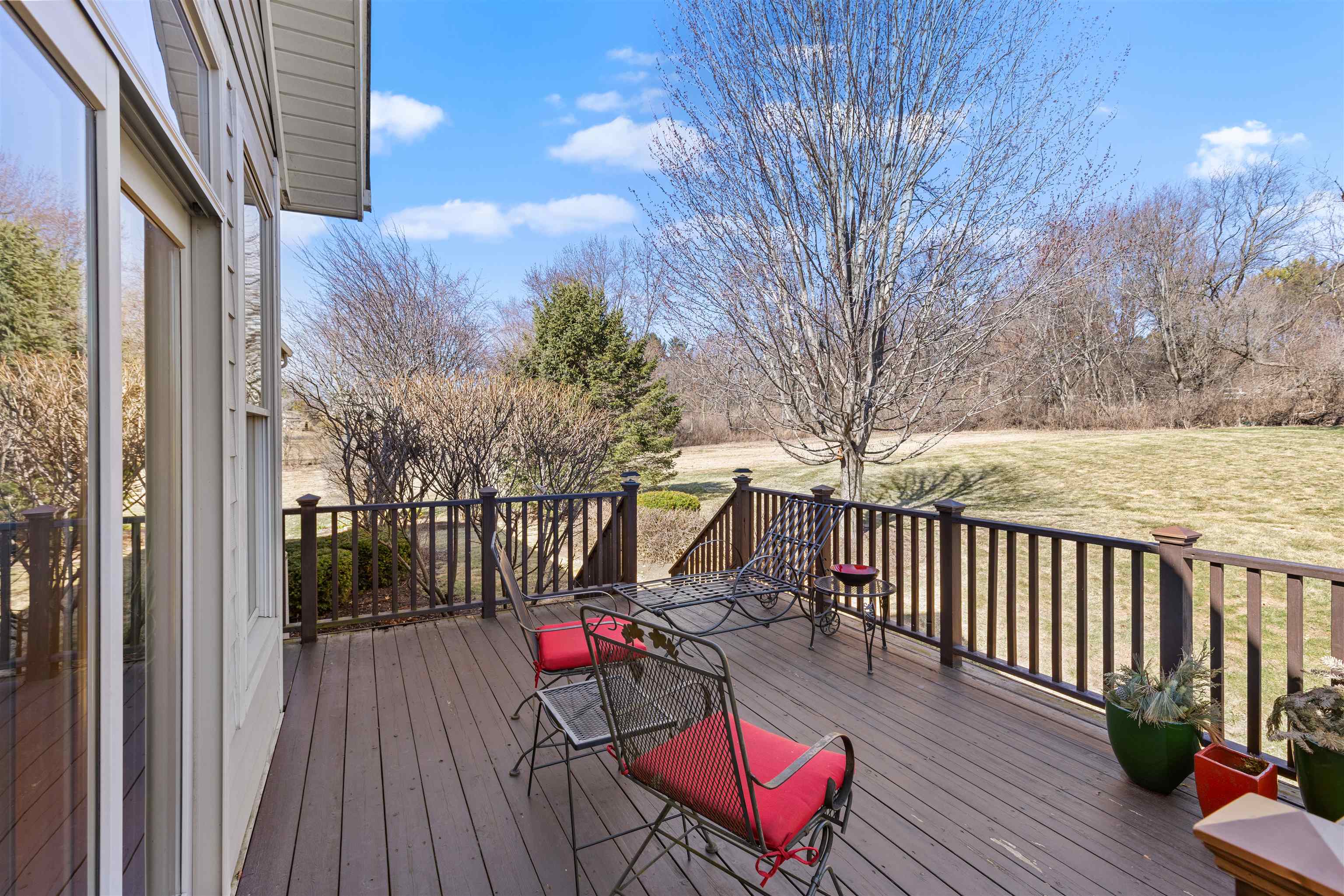978 Weatherfield Way Belvidere, IL 61008 - Photo 36 of 41 a balcony with wooden floor table and chairs
