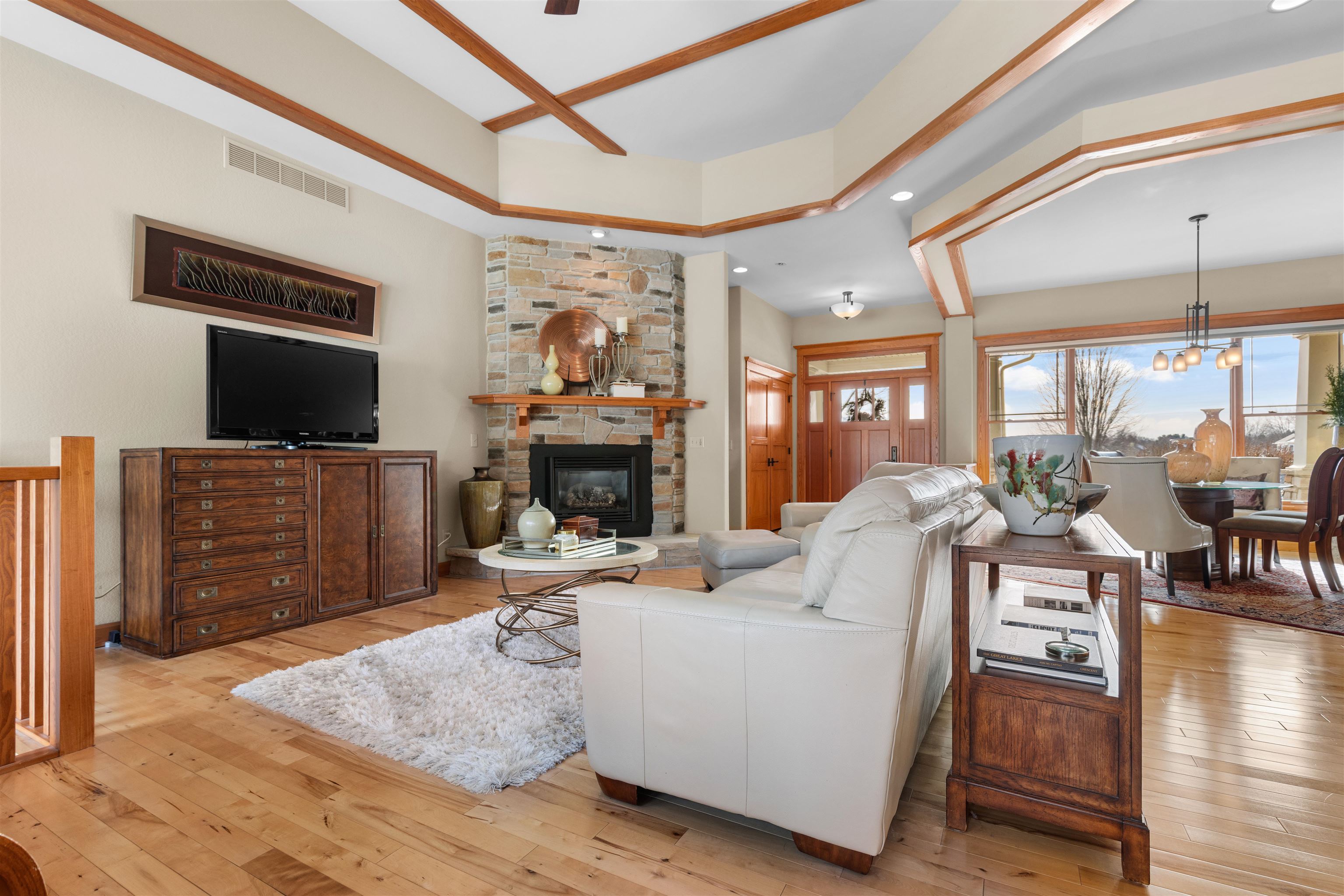 978 Weatherfield Way Belvidere, IL 61008 - Photo 5 of 41 a living room with furniture a flat screen tv and a fireplace