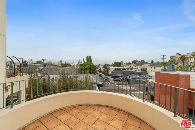 a view of a balcony with city view